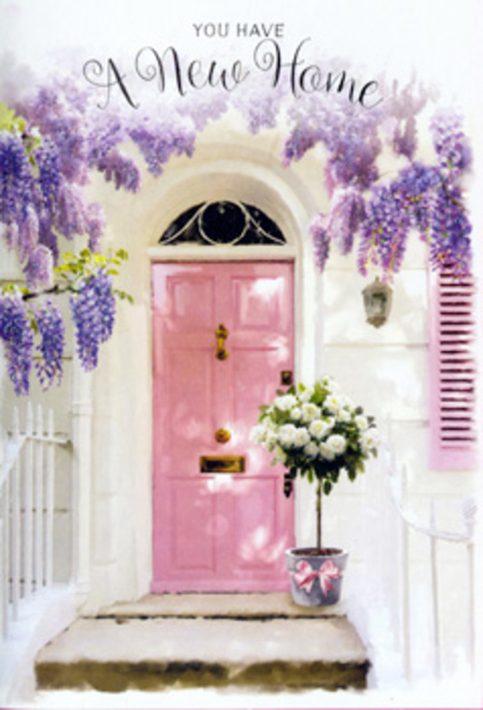 This image captures the tender excitement of arriving at a new home in Rickmansworth, distilled into a single, beautifully styled doorway. A softly painted pink door stands at the centre, its edges slightly sun-kissed, radiating warmth and a subtle sense of personality, like a welcoming smile on a quiet residential street near the Aquadrome. The surrounding walls are whitewashed and calm, reflecting the daylight and allowing the pastel details to gently shine. Above and around the entrance, lush strands of wisteria cascade in velvety lavender drapes, each trailing bloom forming a fragrant curtain that frames the doorway with natural grace. At the foot of the door, resting on the step, a florist's tin bucket in muted grey holds a generous bouquet of white and cream roses. The roses are plush and full, their petals unfolding in layered spirals, softened by airy sprays of fresh greenery that give the arrangement an effortless, garden-fresh charm. A satin pink bow is tied carefully around the bucket, its ribbon ends loosely falling, echoing the tumble of the wisteria and the easy elegance of the scene. Gentle light filters through the flowers overhead, casting soft patterns across the doorstep and bucket, as if the day itself is offering a blessing. The image feels like a thoughtful housewarming surprise created by a Rickmansworth florist who knows how to combine colour, fragrance, and texture to transform a simple entrance into a heartfelt gesture of welcome, hope, and the promise of many happy years ahead.